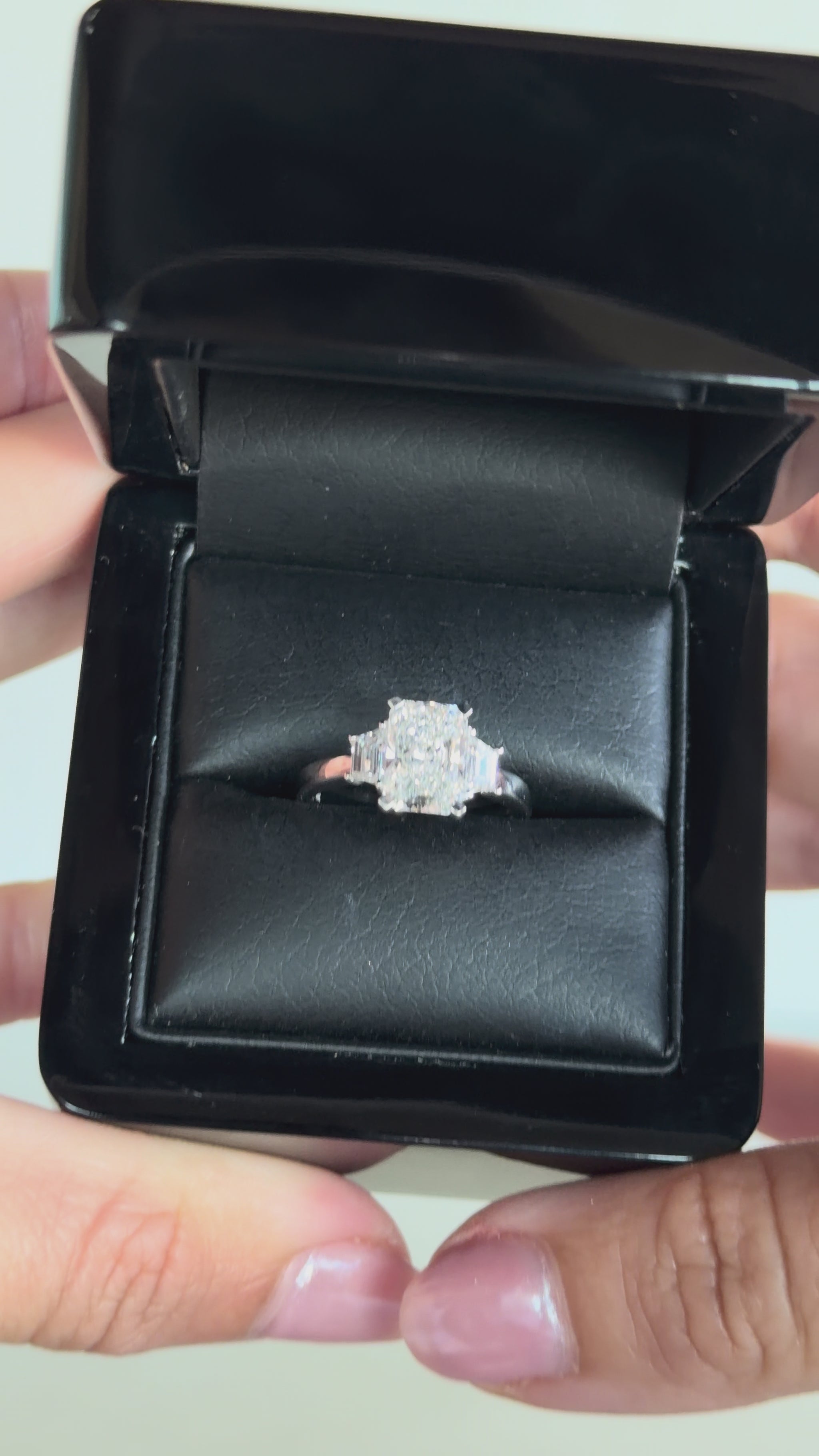 2.56 total carat radiant-cut three-stone diamond ring in white gold